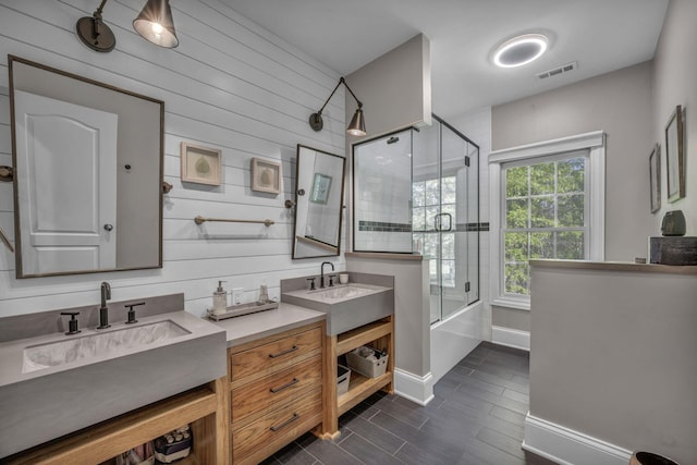 3720 Hyatts Rd, Powell, OH 43065 - full bathroom with combined bath / shower with glass door, wood tiled floors, two vanities, baseboards, and wooden walls