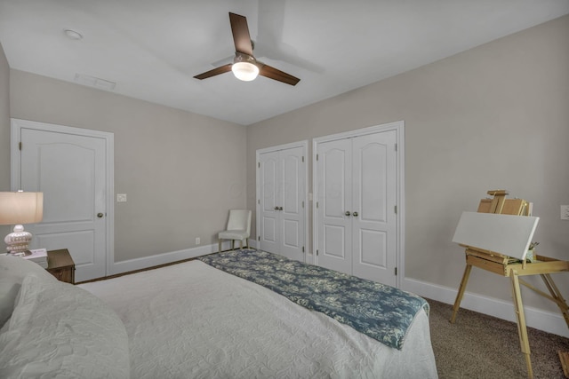 3720 Hyatts Rd, Powell, OH 43065 - bedroom with baseboards, two closets, carpet flooring, and a ceiling fan