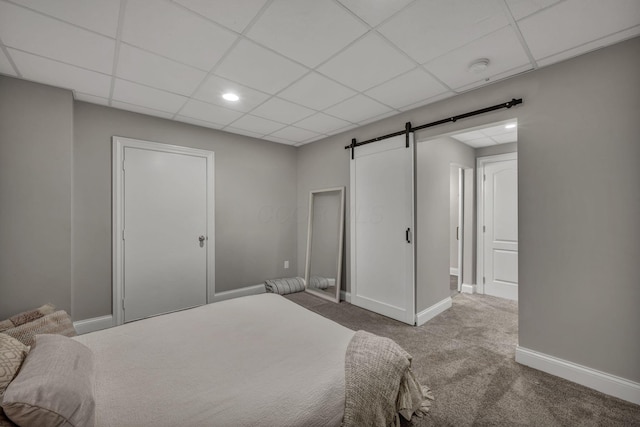 3720 Hyatts Rd, Powell, OH 43065 - bedroom with a barn door, carpet flooring, baseboards, recessed lighting, and a paneled ceiling