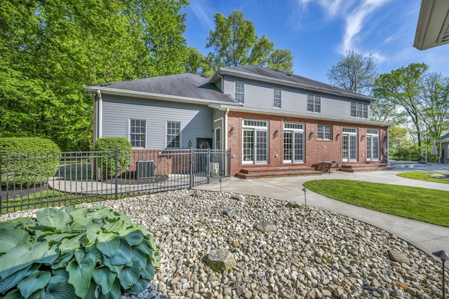 3720 Hyatts Rd, Powell, OH 43065 - rear view of property featuring entry steps, brick siding, cooling unit, fence, and a patio