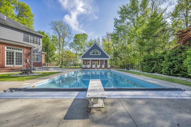 3720 Hyatts Rd, Powell, OH 43065 - view of pool with an exterior structure, a diving board, an outdoor structure, a patio, and a covered pool