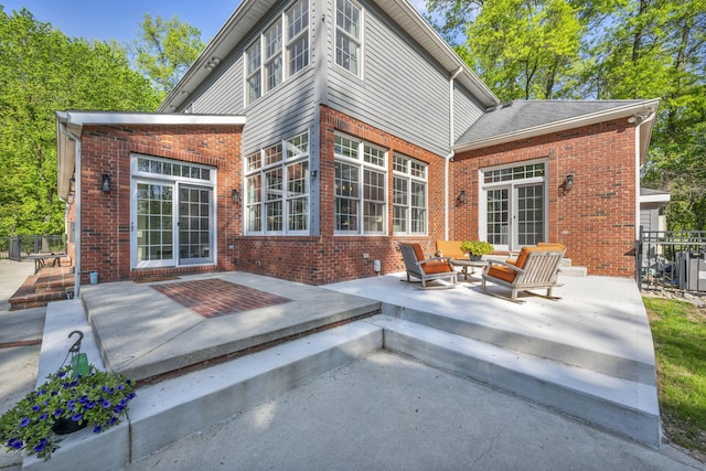 3720 Hyatts Rd, Powell, OH 43065 - back of property with brick siding, a patio area, and outdoor lounge area