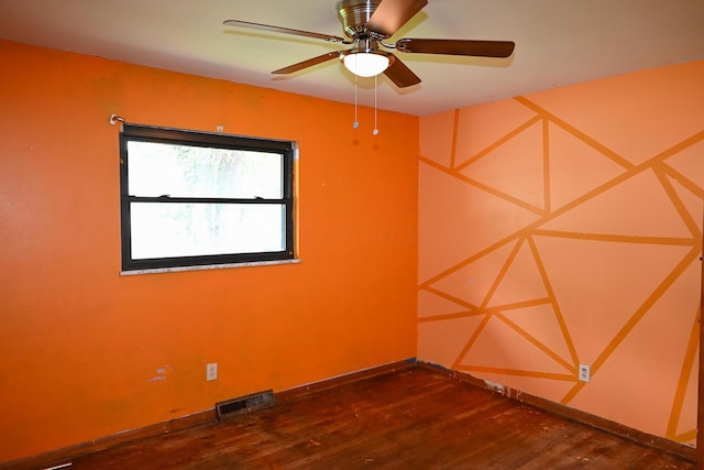 unfurnished room featuring wood finished floors and a ceiling fan