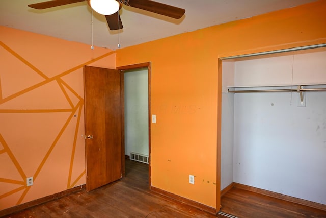 unfurnished bedroom featuring wood finished floors, a closet, and ceiling fan