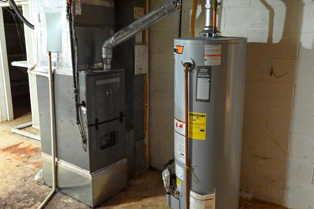 utility room featuring gas water heater and heating unit