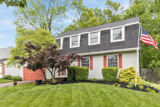 68 Whipple Pl, Westerville, OH 43081 - colonial inspired home with a gambrel roof, roof with shingles, driveway, and a garage