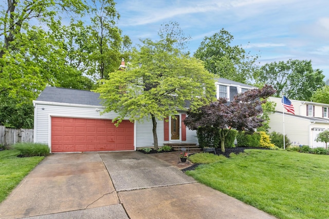 68 Whipple Pl, Westerville, OH 43081 - view of property hidden behind natural elements with an attached garage and concrete driveway