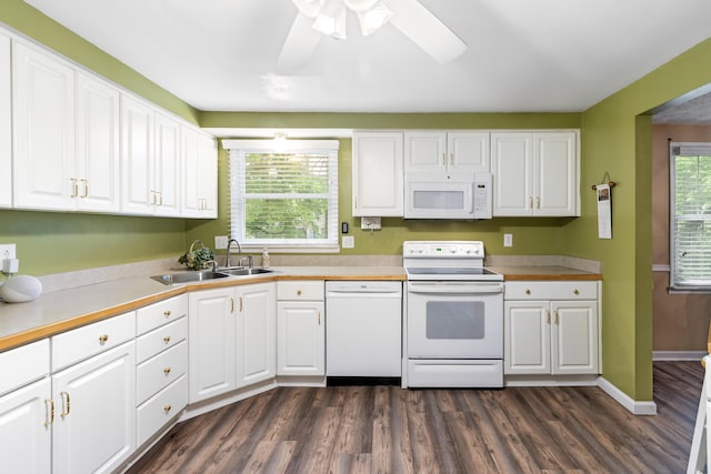 68 Whipple Pl, Westerville, OH 43081 - kitchen featuring white appliances, a sink, dark wood-style flooring, and white cabinets