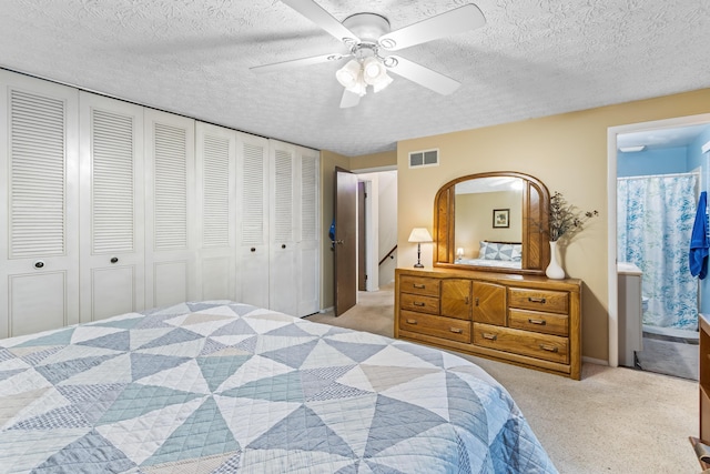 68 Whipple Pl, Westerville, OH 43081 - bedroom with light carpet, a textured ceiling, ensuite bath, arched walkways, and a ceiling fan