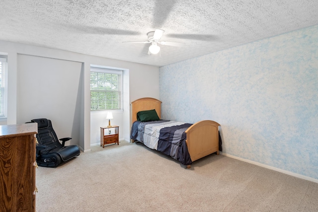 68 Whipple Pl, Westerville, OH 43081 - bedroom with carpet, ceiling fan, wallpapered walls, baseboards, and a textured ceiling