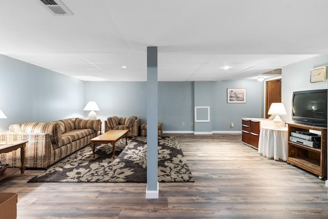 68 Whipple Pl, Westerville, OH 43081 - living room with a drop ceiling, wood finished floors, and baseboards