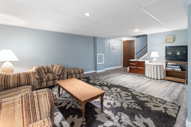68 Whipple Pl, Westerville, OH 43081 - living area with wood finished floors, stairs, baseboards, a drop ceiling, and recessed lighting
