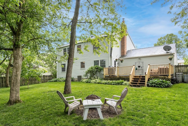 68 Whipple Pl, Westerville, OH 43081 - back of property with a wooden deck, a fire pit, and central AC