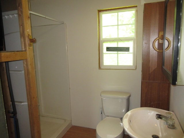 6800 Center Rd, Philo, OH 43771 - full bath with a sink, a shower stall, toilet, and wood finished floors