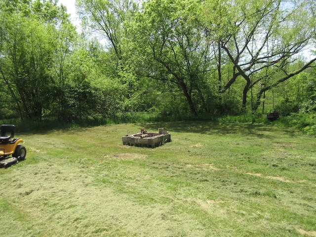 6800 Center Rd, Philo, OH 43771 - view of grassy yard featuring a fire pit