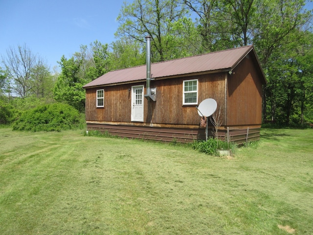 6800 Center Rd, Philo, OH 43771 - rear view of property featuring metal roof and a yard