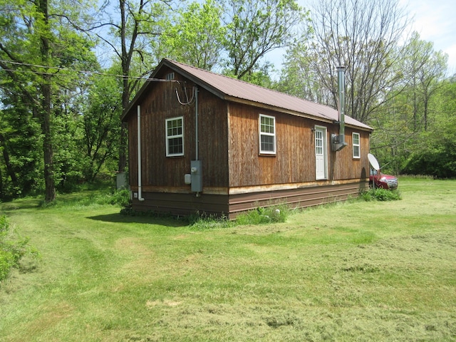 6800 Center Rd, Philo, OH 43771 - view of property exterior with metal roof and a yard