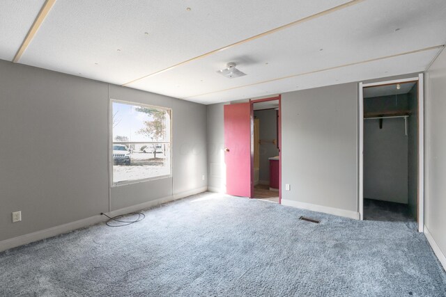 376 Benton Rd, Sycamore, OH 44882 - unfurnished bedroom with carpet, baseboards, and a closet