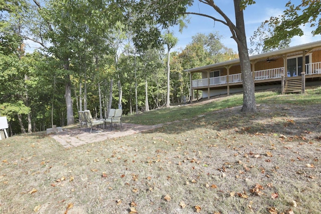 54780 Opossum Run Rd, Senecaville, OH 43780 - view of yard featuring ceiling fan, a wooden deck, and a patio