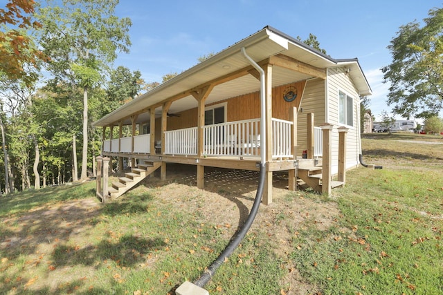 54780 Opossum Run Rd, Senecaville, OH 43780 - view of home's exterior with stairway and a lawn
