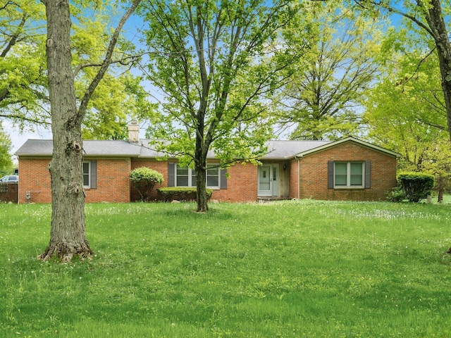 3182 Grey Fox Dr, Columbus, OH 43230 - ranch-style house featuring brick siding, a front yard, and a chimney
