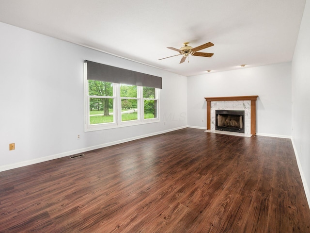 3182 Grey Fox Dr, Columbus, OH 43230 - unfurnished living room featuring ceiling fan, dark wood-type flooring, a high end fireplace, and baseboards