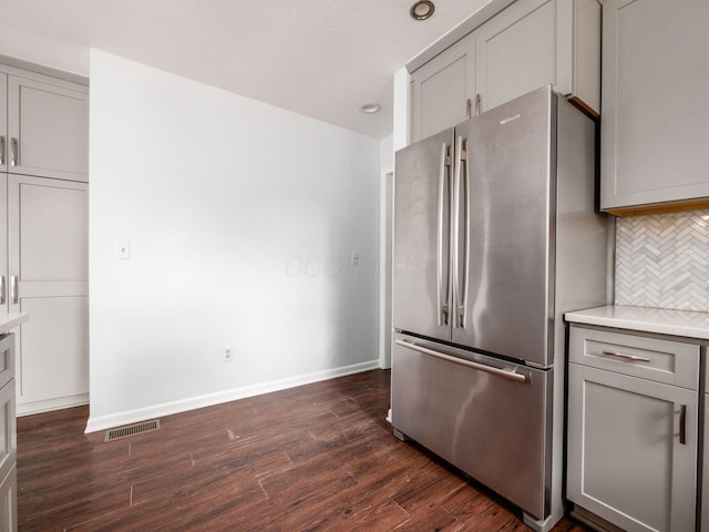 3182 Grey Fox Dr, Columbus, OH 43230 - kitchen featuring freestanding refrigerator, gray cabinetry, dark wood-type flooring, tasteful backsplash, and baseboards