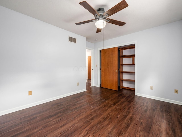 3182 Grey Fox Dr, Columbus, OH 43230 - unfurnished bedroom with dark wood-style flooring, baseboards, a closet, and a ceiling fan