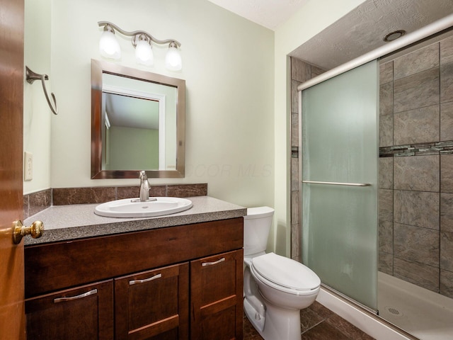 3182 Grey Fox Dr, Columbus, OH 43230 - bathroom featuring a shower stall, toilet, and vanity