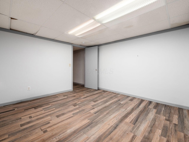 3182 Grey Fox Dr, Columbus, OH 43230 - unfurnished room featuring a drop ceiling, wood finished floors, and baseboards