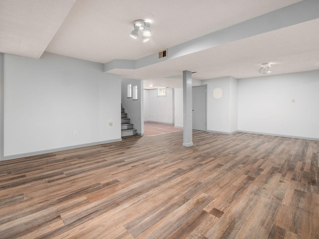 3182 Grey Fox Dr, Columbus, OH 43230 - finished basement with stairway, wood finished floors, and baseboards