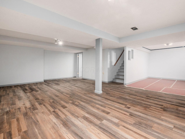 3182 Grey Fox Dr, Columbus, OH 43230 - finished below grade area with wood finished floors, baseboards, and stairs