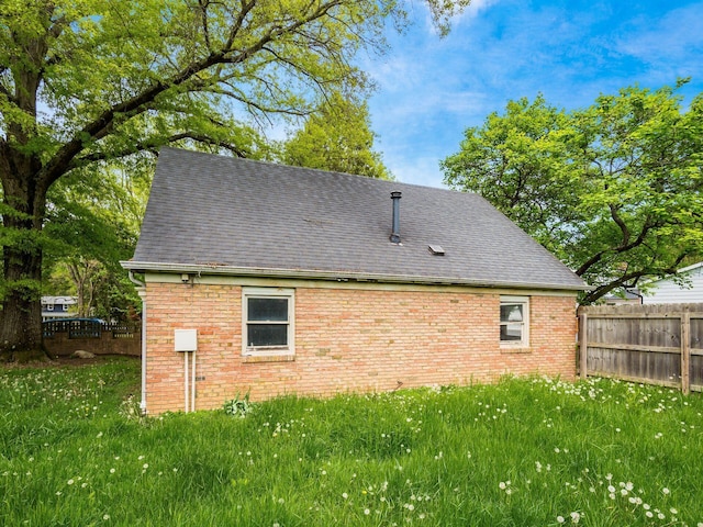 3182 Grey Fox Dr, Columbus, OH 43230 - view of home's exterior with a shingled roof and brick siding