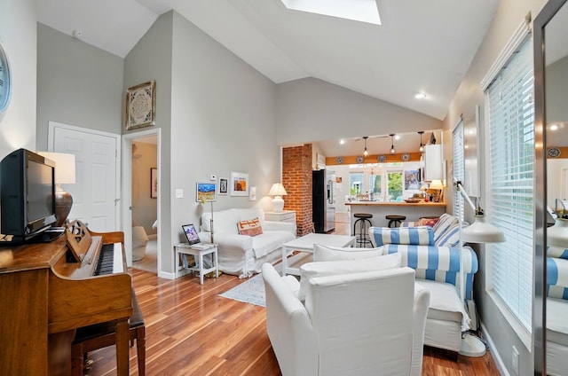 286 Rosslyn Ave, Columbus, OH 43214 - living room with light wood-style flooring, high vaulted ceiling, and baseboards
