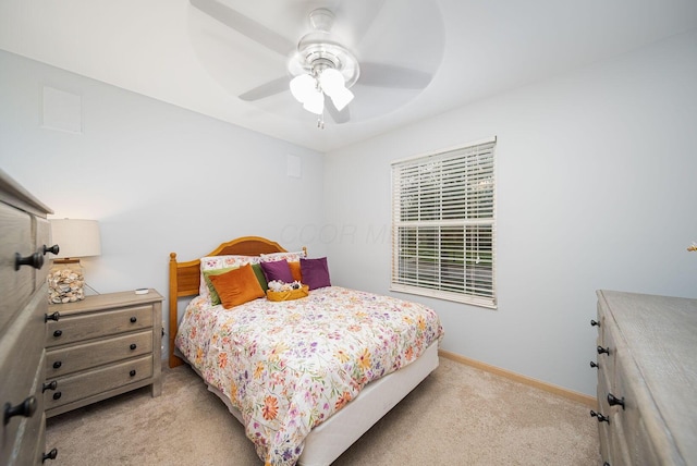 bedroom featuring light carpet, baseboards, and ceiling fan