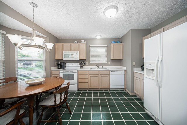 kitchen featuring white appliances, light brown cabinets, a sink, a chandelier, and light countertops