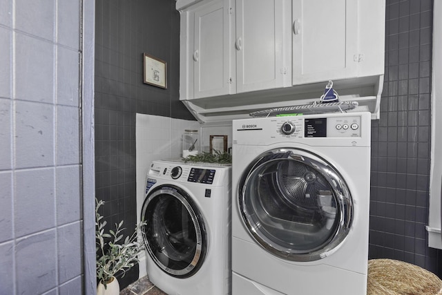 1096 Church St, Logan, OH 43138 - laundry room featuring tile walls, washer and dryer, and cabinet space