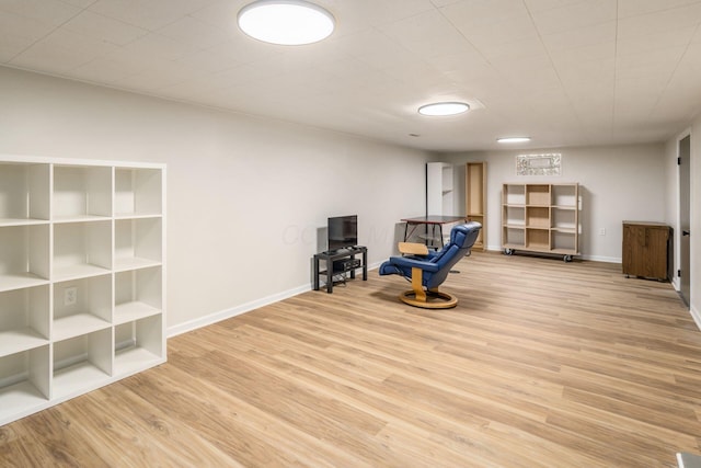 sitting room with light wood-style flooring and baseboards