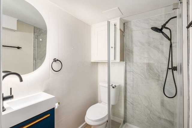 full bath featuring toilet, a shower stall, and vanity