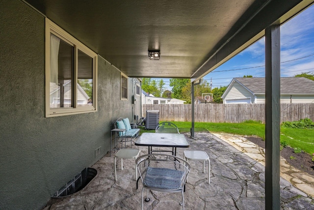 view of patio with central air condition unit and a fenced backyard