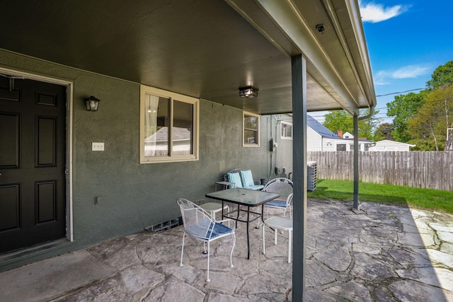 view of patio / terrace featuring fence and central AC