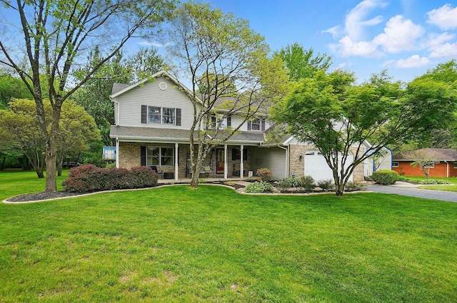 7227 Stemen Rd, Pickerington, OH 43147 - traditional-style house with a porch, concrete driveway, a front lawn, and a garage