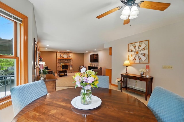 7227 Stemen Rd, Pickerington, OH 43147 - dining room featuring healthy amount of natural light, a fireplace, ceiling fan, recessed lighting, and tile patterned floors