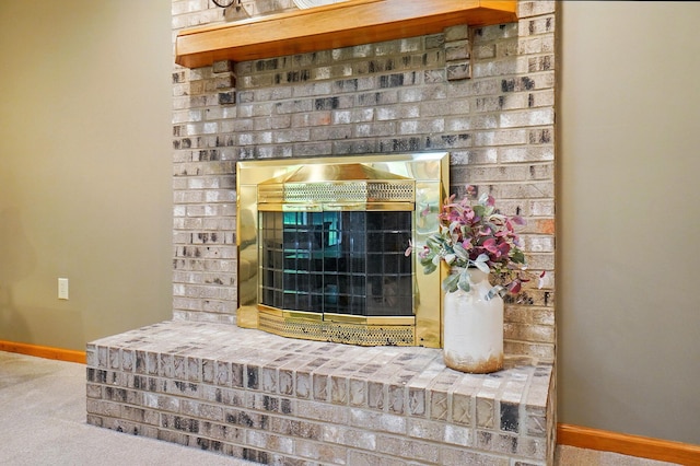 7227 Stemen Rd, Pickerington, OH 43147 - detailed view of baseboards, a brick fireplace, and carpet floors