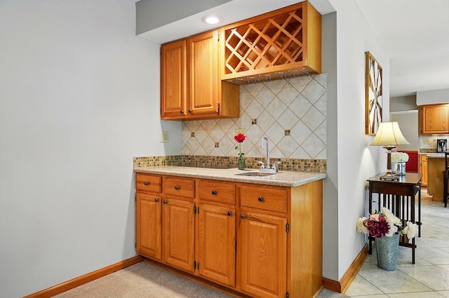 7227 Stemen Rd, Pickerington, OH 43147 - kitchen with a sink, decorative backsplash, light countertops, and baseboards