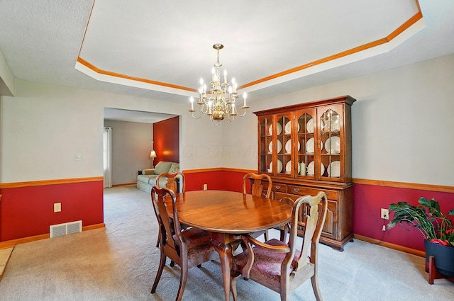 7227 Stemen Rd, Pickerington, OH 43147 - carpeted dining room featuring a tray ceiling, a chandelier, and baseboards