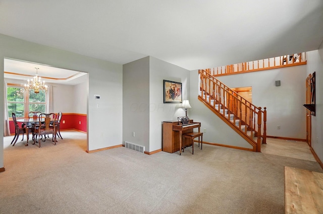 7227 Stemen Rd, Pickerington, OH 43147 - carpeted living room featuring a chandelier, baseboards, and stairs