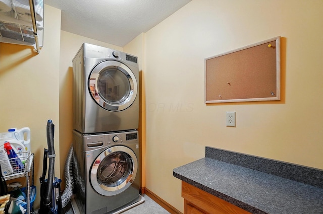 7227 Stemen Rd, Pickerington, OH 43147 - washroom with stacked washing machine and dryer, carpet, and baseboards