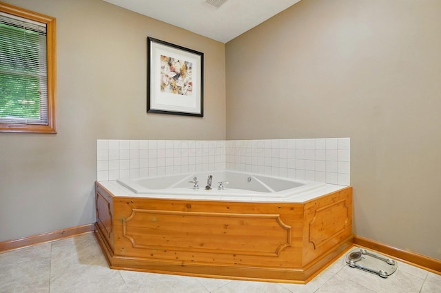 7227 Stemen Rd, Pickerington, OH 43147 - bathroom with baseboards, a bath, and tile patterned flooring