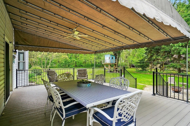 7227 Stemen Rd, Pickerington, OH 43147 - wooden terrace with outdoor dining area, a lawn, and a ceiling fan